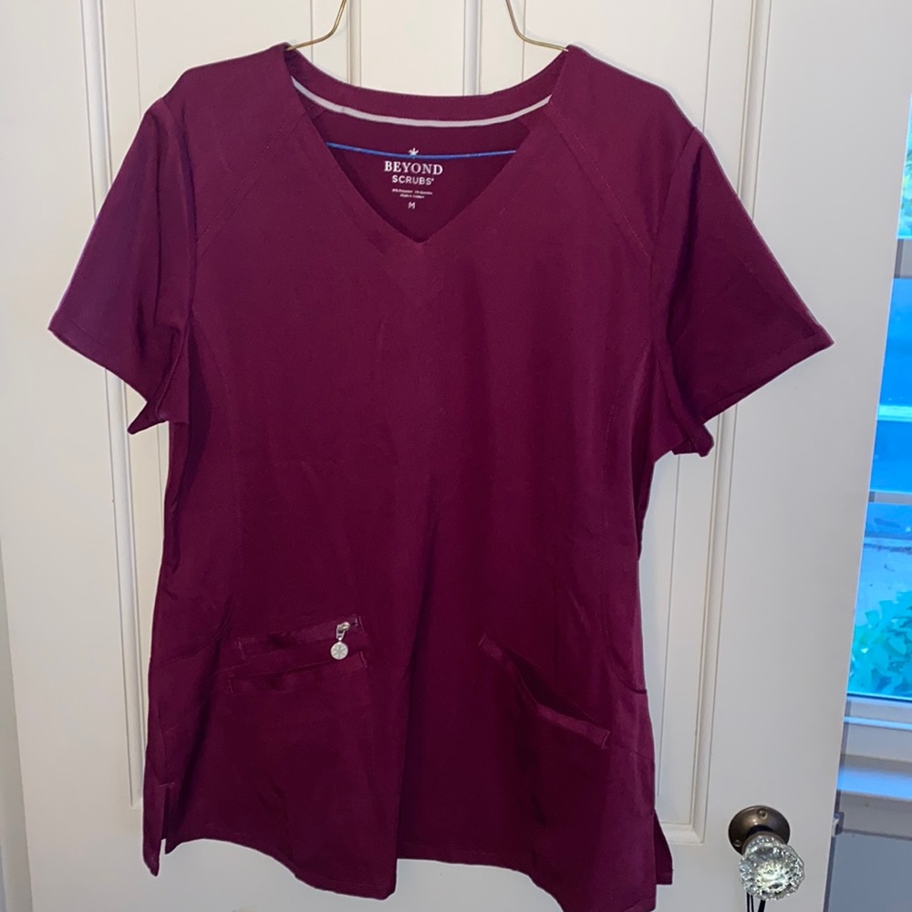 A very soft maroon scrub top